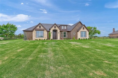 Located near the charming city of Denison, TX, 31 Golf Walk Cir on Denison Country Club in Texas - for sale on GolfHomes.com, golf home, golf lot