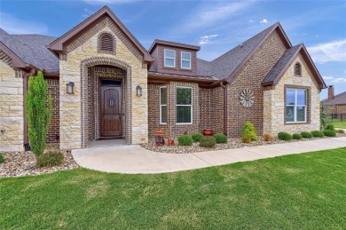 Located near the charming city of Denison, TX, 31 Golf Walk Cir on Denison Country Club in Texas - for sale on GolfHomes.com, golf home, golf lot