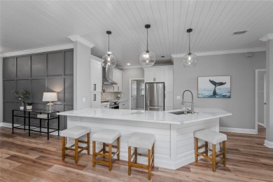 One or more photo(s) has been virtually staged. Showstopper Home on The Eagles Golf Course and Club in Florida - for sale on GolfHomes.com, golf home, golf lot