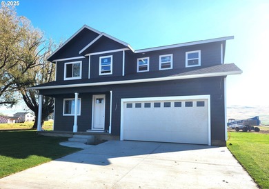 Experience elevated living in this stunning new construction on Buffalo Peak Golf Course in Oregon - for sale on GolfHomes.com, golf home, golf lot
