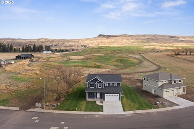 Experience elevated living in this stunning new construction on Buffalo Peak Golf Course in Oregon - for sale on GolfHomes.com, golf home, golf lot