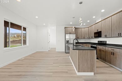 Experience elevated living in this stunning new construction on Buffalo Peak Golf Course in Oregon - for sale on GolfHomes.com, golf home, golf lot