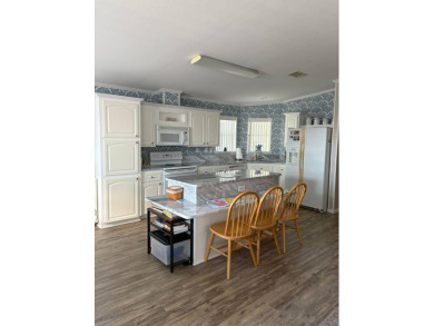 This 2001 Jacobsen fully furnished home offers 2 bedrooms, 2 on Sabal Springs Golf and Racquet Club in Florida - for sale on GolfHomes.com, golf home, golf lot