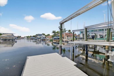 Picture yourself in a tropical oasis, where lush landscapes and on Gulf Harbors Golf Course in Florida - for sale on GolfHomes.com, golf home, golf lot