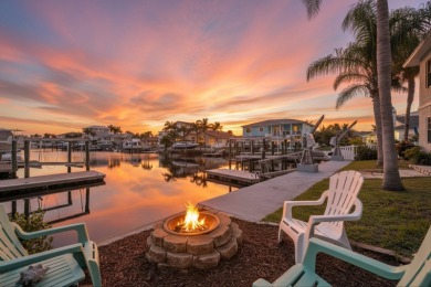 Picture yourself in a tropical oasis, where lush landscapes and on Gulf Harbors Golf Course in Florida - for sale on GolfHomes.com, golf home, golf lot