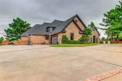 Welcome to a refined residence nestled on the prestigious west on Oak Tree National Golf and Country Club in Oklahoma - for sale on GolfHomes.com, golf home, golf lot