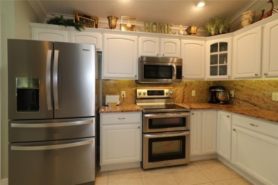 Welcome in to this gorgeous 3/2 Lantana with a golf cart garage on The Links of Spruce Creek in Florida - for sale on GolfHomes.com, golf home, golf lot