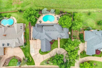 Welcome to a refined residence nestled on the prestigious west on Oak Tree National Golf and Country Club in Oklahoma - for sale on GolfHomes.com, golf home, golf lot