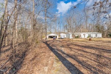 Beautiful 1.84 Acre Golf Course Wooded Lot convenient to on Occoneechee Golf Club in North Carolina - for sale on GolfHomes.com, golf home, golf lot