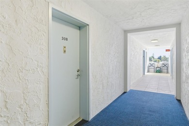 Step inside this beautifully remodeled 3rd-floor, 2-bedroom on IMG Academies Golf and Country Club in Florida - for sale on GolfHomes.com, golf home, golf lot