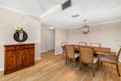 Step inside this beautifully remodeled 3rd-floor, 2-bedroom on IMG Academies Golf and Country Club in Florida - for sale on GolfHomes.com, golf home, golf lot