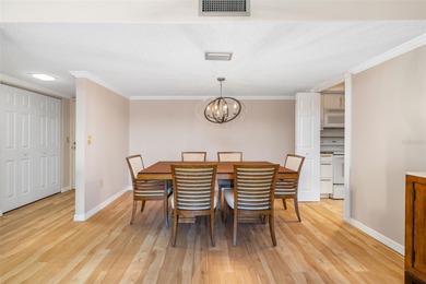 Step inside this beautifully remodeled 3rd-floor, 2-bedroom on IMG Academies Golf and Country Club in Florida - for sale on GolfHomes.com, golf home, golf lot