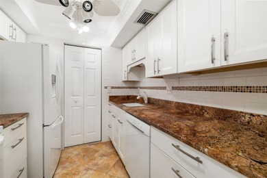 Step inside this beautifully remodeled 3rd-floor, 2-bedroom on IMG Academies Golf and Country Club in Florida - for sale on GolfHomes.com, golf home, golf lot