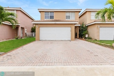 Spectacular LAKE VIEWS from this 4 bedroom 2.5 bath home located on Inverrary Country Club in Florida - for sale on GolfHomes.com, golf home, golf lot