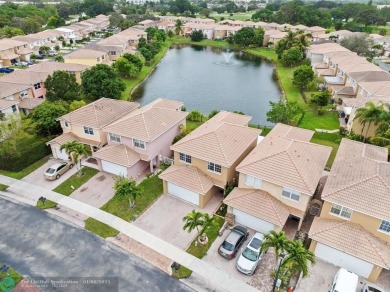 Spectacular LAKE VIEWS from this 4 bedroom 2.5 bath home located on Inverrary Country Club in Florida - for sale on GolfHomes.com, golf home, golf lot