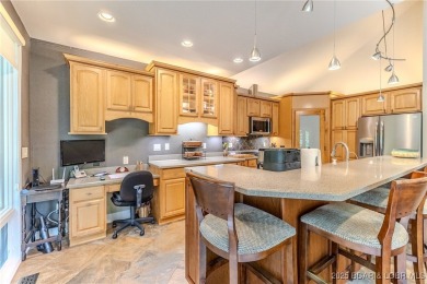 Welcome to this stunning home designed for luxurious living in on Seasons Ridge At Four Seasons in Missouri - for sale on GolfHomes.com, golf home, golf lot