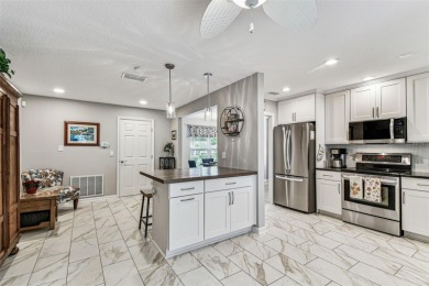 The minute you walk through the door of this gorgeous Highland on Highland Lakes Executive Golf Course in Florida - for sale on GolfHomes.com, golf home, golf lot