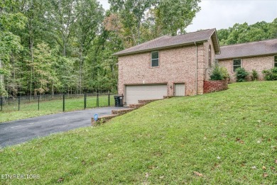 This beautiful brick BASEMENT RANCH home, nestled on 2 lots in on Lake Tansi Village Country Club in Tennessee - for sale on GolfHomes.com, golf home, golf lot