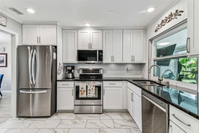 The minute you walk through the door of this gorgeous Highland on Highland Lakes Executive Golf Course in Florida - for sale on GolfHomes.com, golf home, golf lot