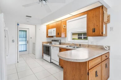 This inviting 3-bedroom, 3 and 1/2 bathroom home  perfect blend on Quail Ridge Golf Course and Country Club in Florida - for sale on GolfHomes.com, golf home, golf lot