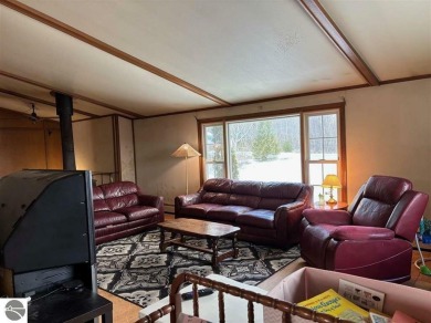 Located on a peaceful golf course and just moments from 500 ft on Antrim Dells Golf Course in Michigan - for sale on GolfHomes.com, golf home, golf lot