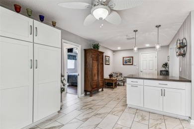 The minute you walk through the door of this gorgeous Highland on Highland Lakes Executive Golf Course in Florida - for sale on GolfHomes.com, golf home, golf lot