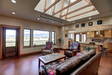 Welcome to this beautiful custom-built home in the Mission Bay on Polson Bay Golf Course - Championship Course in Montana - for sale on GolfHomes.com, golf home, golf lot