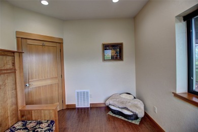 Welcome to this beautiful custom-built home in the Mission Bay on Polson Bay Golf Course - Championship Course in Montana - for sale on GolfHomes.com, golf home, golf lot