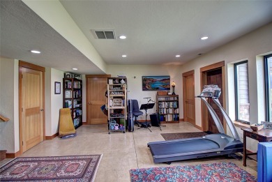 Welcome to this beautiful custom-built home in the Mission Bay on Polson Bay Golf Course - Championship Course in Montana - for sale on GolfHomes.com, golf home, golf lot