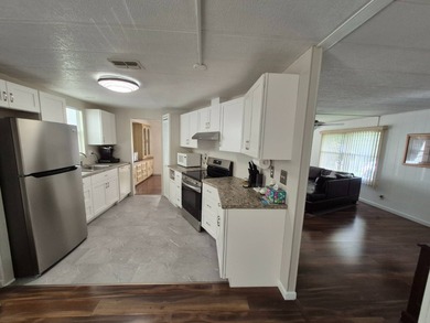 This 1982 2 bed 2 bath is in a 55+ Spanish lakes community. It on Spanish Lakes Country Club in Florida - for sale on GolfHomes.com, golf home, golf lot