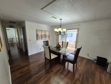 This 1982 2 bed 2 bath is in a 55+ Spanish lakes community. It on Spanish Lakes Country Club in Florida - for sale on GolfHomes.com, golf home, golf lot