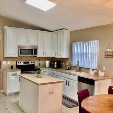 Located at Stonebridge Lakes in MetroWest this brightness on MetroWest Golf Club in Florida - for sale on GolfHomes.com, golf home, golf lot