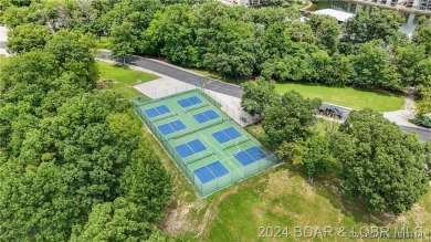 Welcome to your lakefront retreat in the most sought after on Seasons Ridge At Four Seasons in Missouri - for sale on GolfHomes.com, golf home, golf lot