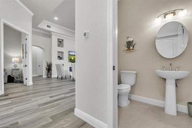 Discover the epitome of luxurious, low maintenance living in on River Hall Country Club in Florida - for sale on GolfHomes.com, golf home, golf lot