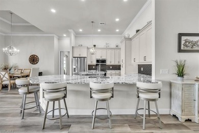 Discover the epitome of luxurious, low maintenance living in on River Hall Country Club in Florida - for sale on GolfHomes.com, golf home, golf lot