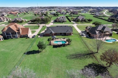 Nestled in an exclusive luxury community. Experience the best of on Tangle Ridge Golf Club in Texas - for sale on GolfHomes.com, golf home, golf lot