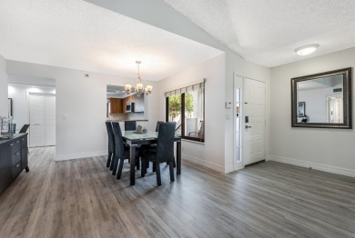 Discover modern living at its finest in this beautifully on Gleneagles Golf and Country Club in Florida - for sale on GolfHomes.com, golf home, golf lot