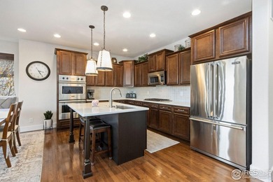 Set on a generous corner lot in Highland Meadows Golf Course on Highland Meadows Golf Course in Colorado - for sale on GolfHomes.com, golf home, golf lot