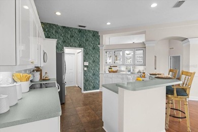 Tucked away among tree-lined streets and mature landscaping in on River Wilderness Golf and Country Club in Florida - for sale on GolfHomes.com, golf home, golf lot