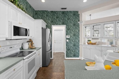 Tucked away among tree-lined streets and mature landscaping in on River Wilderness Golf and Country Club in Florida - for sale on GolfHomes.com, golf home, golf lot