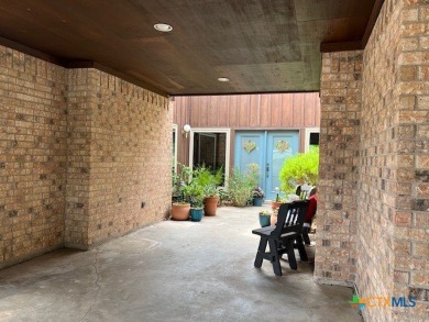 Welcome to your dream home-an exquisite mid-century modern on Victoria Country Club in Texas - for sale on GolfHomes.com, golf home, golf lot