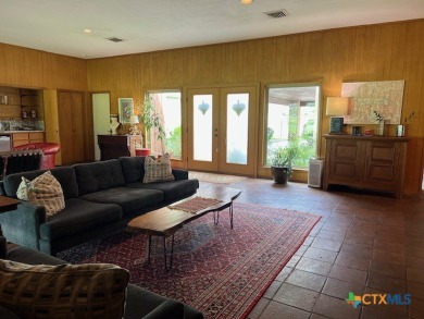 Welcome to your dream home-an exquisite mid-century modern on Victoria Country Club in Texas - for sale on GolfHomes.com, golf home, golf lot