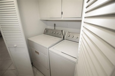 NESTLED IN ONE OF PALM AIRE COUNTRY CLUB'S MOST DESIRABLE on Palm-Aire Country Club and Resort - The Oaks in Florida - for sale on GolfHomes.com, golf home, golf lot