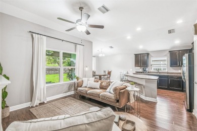 Beautifully maintained and decorated with style, this on Meadow Oaks Golf and Country Club in Florida - for sale on GolfHomes.com, golf home, golf lot
