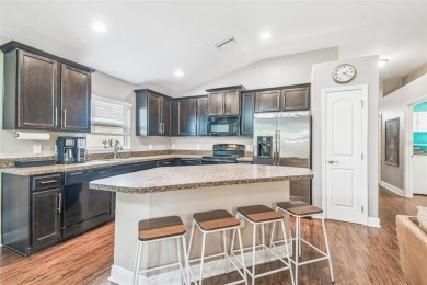 Beautifully maintained and decorated with style, this on Meadow Oaks Golf and Country Club in Florida - for sale on GolfHomes.com, golf home, golf lot
