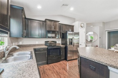 Beautifully maintained and decorated with style, this on Meadow Oaks Golf and Country Club in Florida - for sale on GolfHomes.com, golf home, golf lot
