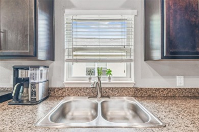 Beautifully maintained and decorated with style, this on Meadow Oaks Golf and Country Club in Florida - for sale on GolfHomes.com, golf home, golf lot