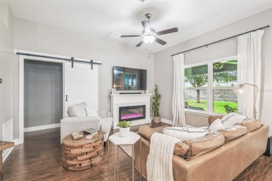 Beautifully maintained and decorated with style, this on Meadow Oaks Golf and Country Club in Florida - for sale on GolfHomes.com, golf home, golf lot