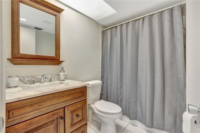 Enjoy beautiful golf course views from the large screened porch on Flamingo Lakes Country Club in Florida - for sale on GolfHomes.com, golf home, golf lot