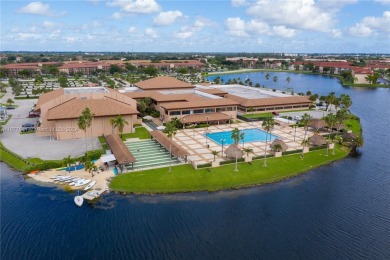 Enjoy beautiful golf course views from the large screened porch on Flamingo Lakes Country Club in Florida - for sale on GolfHomes.com, golf home, golf lot